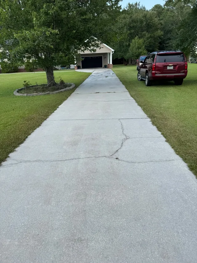 Bright clean concrete driveway after pressure washing in Jacksonville NC