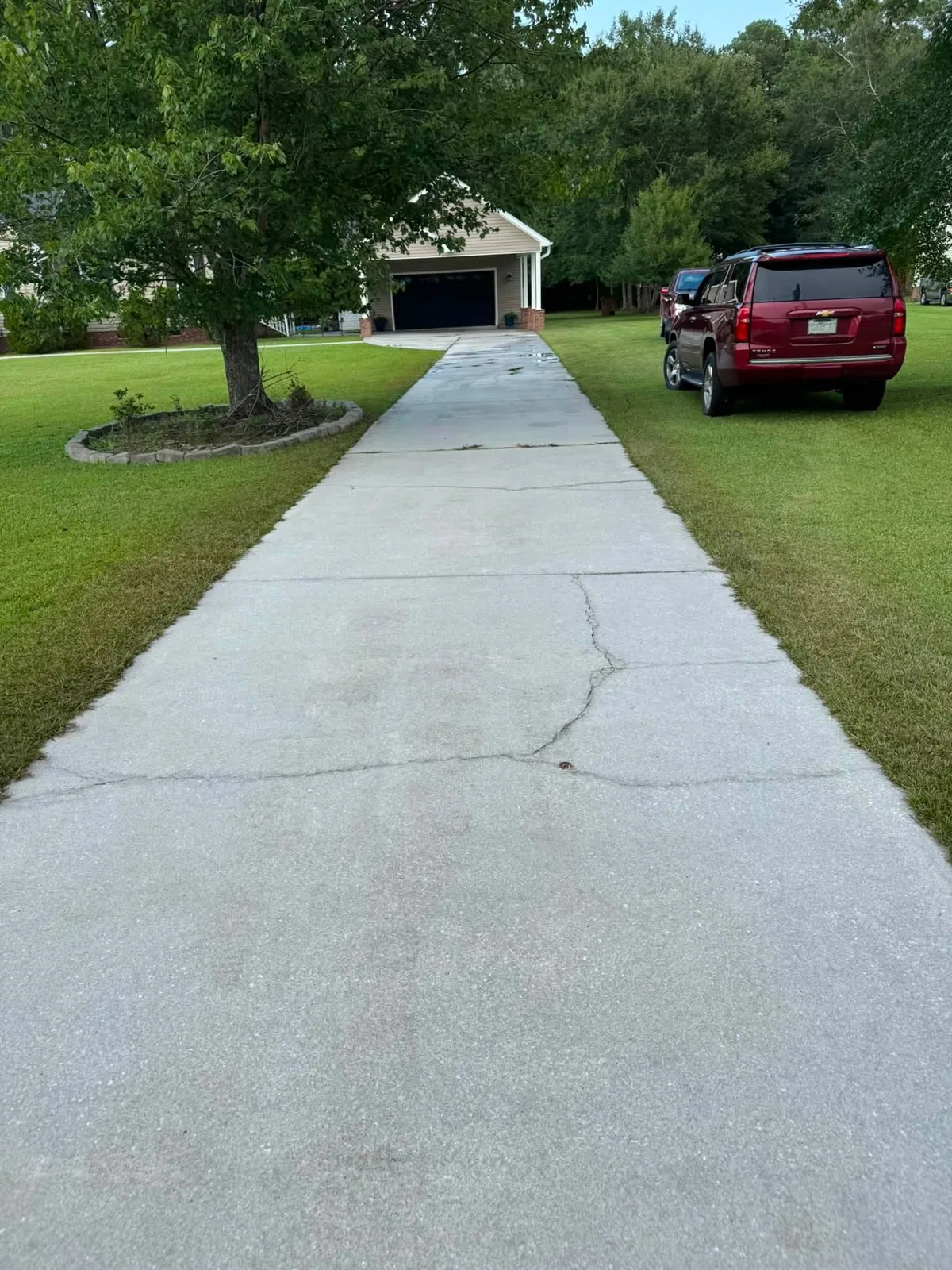 Stained concrete driveway before cleaning in Jacksonville NC