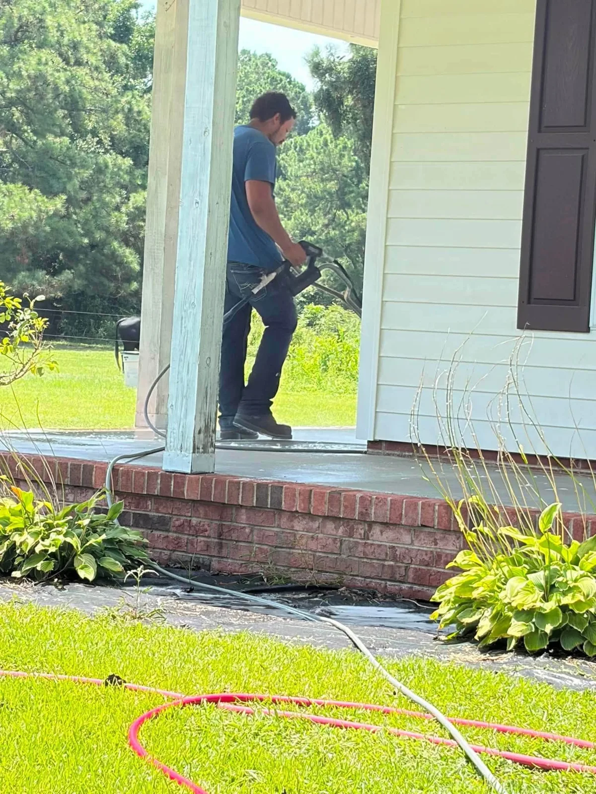 Eric Merritt of Ray-Nor-Shine Pro Wash washing a front porch in Jacksonville NC