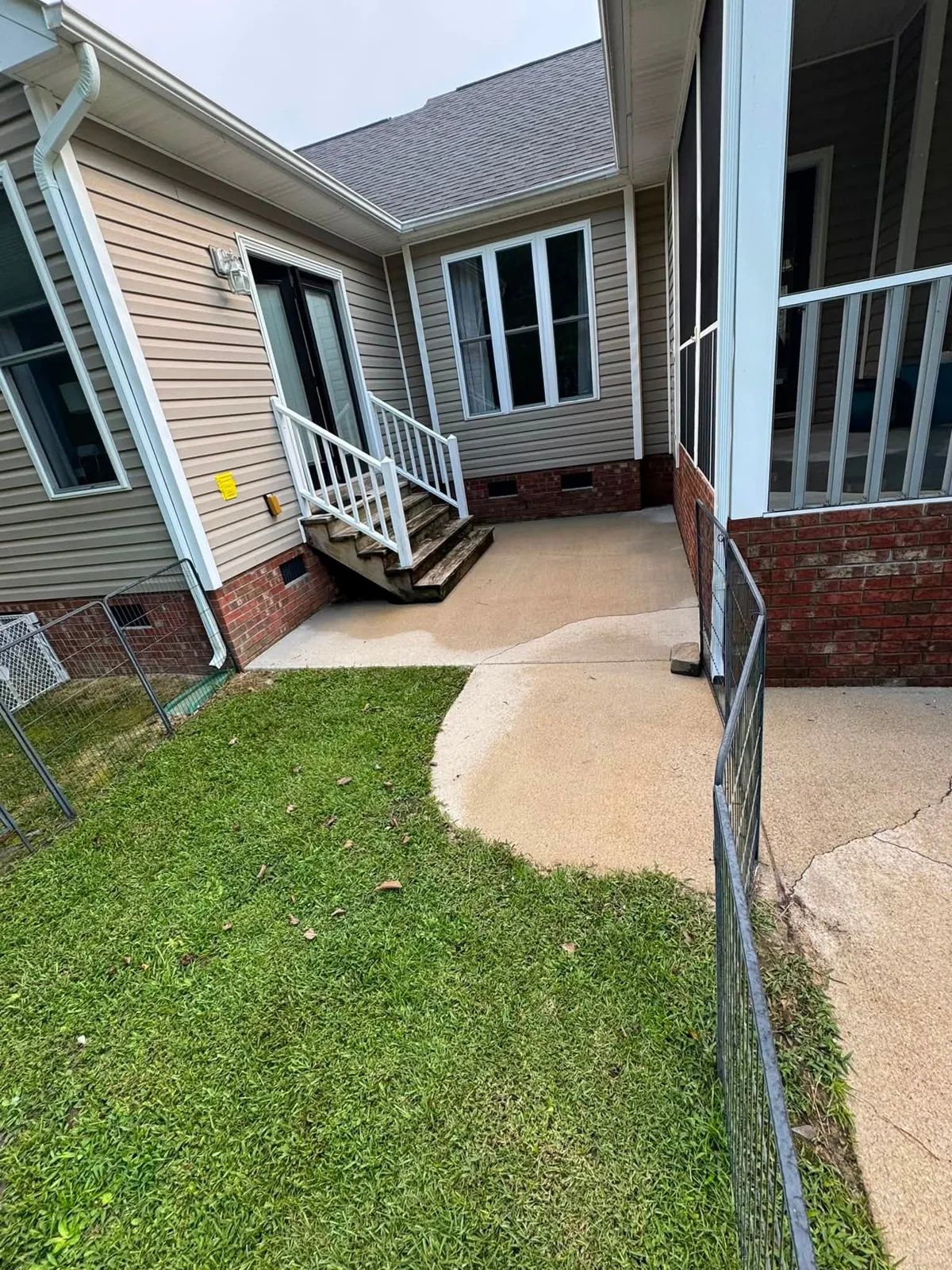 Clean house corner and walkway after soft washing
